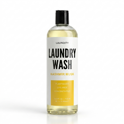 A bottle of LAUNDITY Laundry Wash in the Kashmir Musk scent, featuring a white label with black and yellow text, filled with a pale yellow liquid, and topped with a black cap, set against a plain white background.